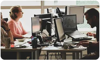 Early Aegis Softtech team working on IT outsourcing and software development projects in 2003